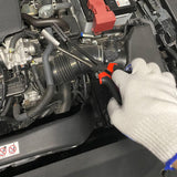 Spark plug wire removal pliers tool for vehicle repairs with ergonomic handle and angled head design.